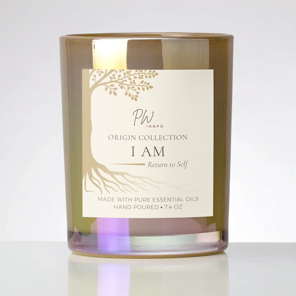 PW Inspo I AM coconut-soy candle in a mineral ash glass vessel with cream and gold label, part of The Origin Collection.