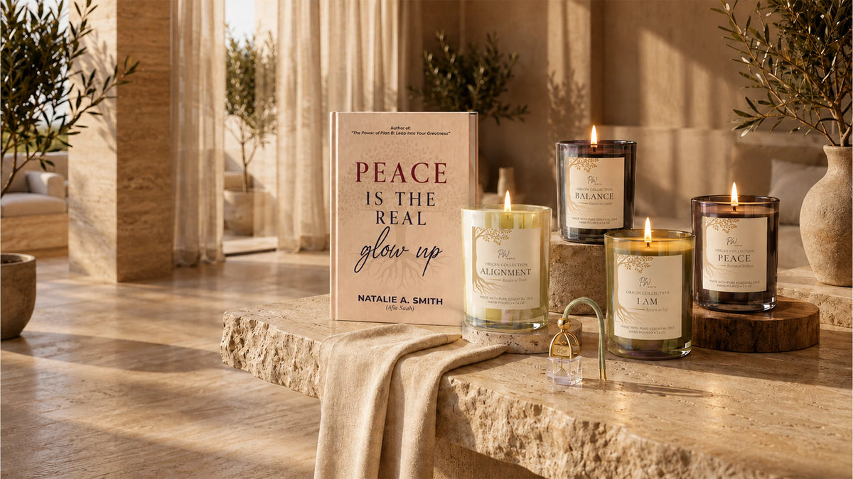 PW Inspo Origin Collection featuring Peace, Balance, I AM, and Alignment coconut-soy candles, displayed with the book Peace Is the Real Glow Up in an elegant, sunlit setting